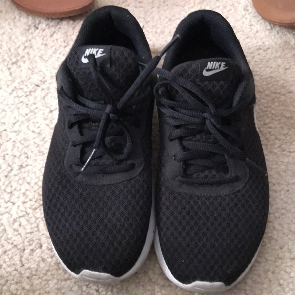 White and black Nike free runs