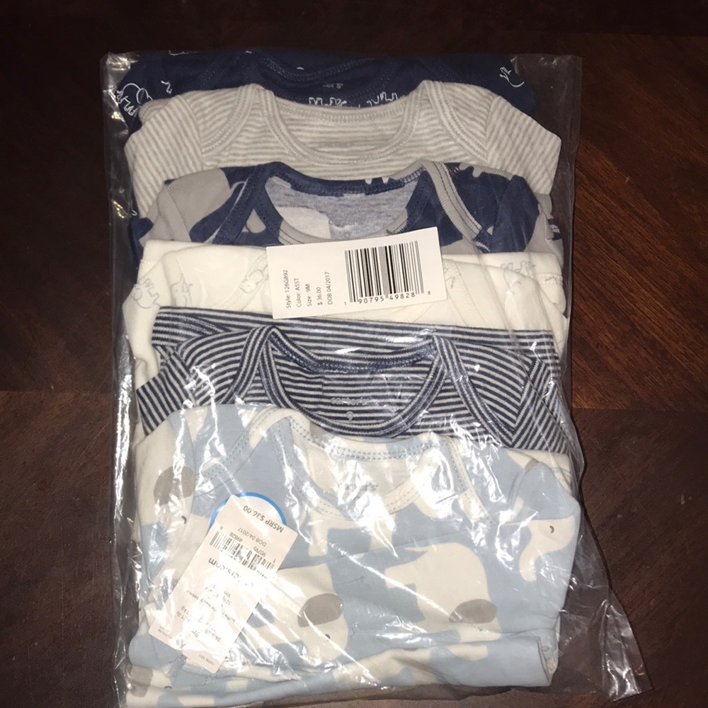 9 months Carter’s Six infant onesies .