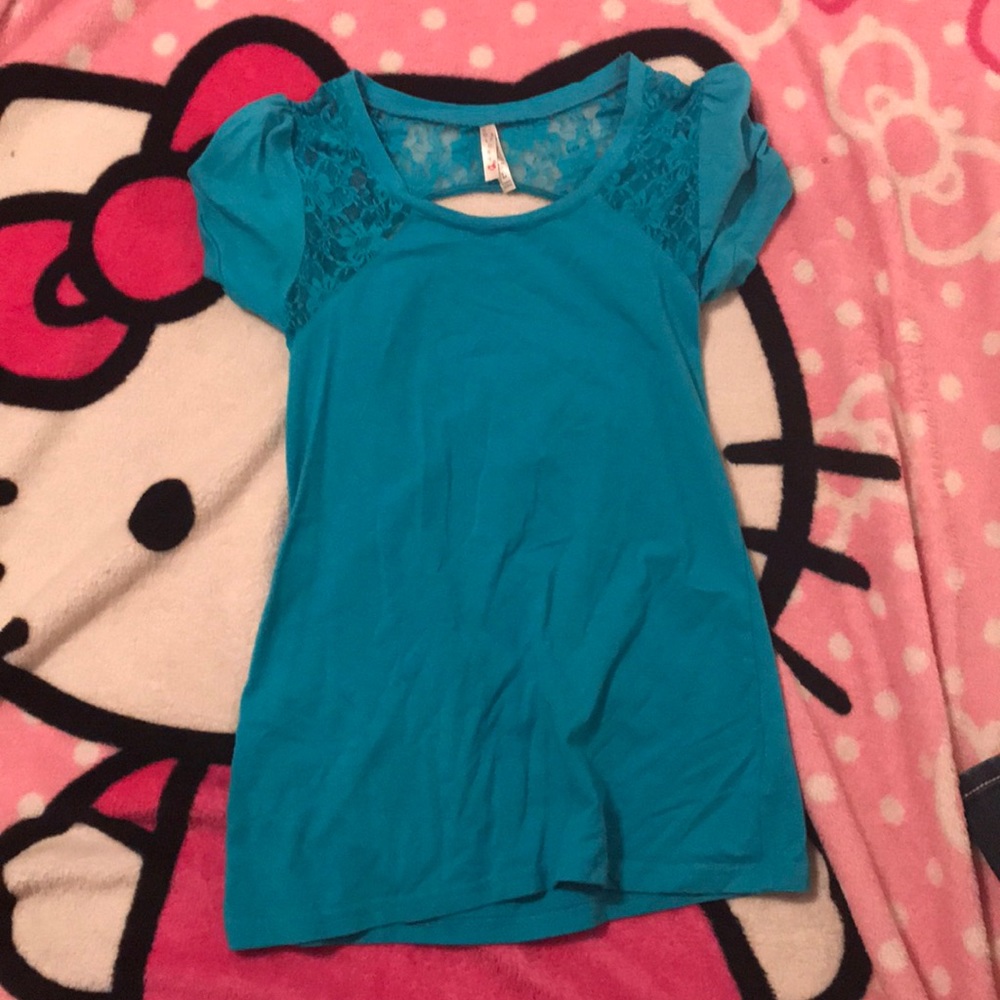 Blue shirt with cut in the back as shown. Size L.