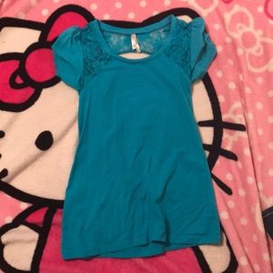 Blue shirt with cut in the back as shown. Size L.