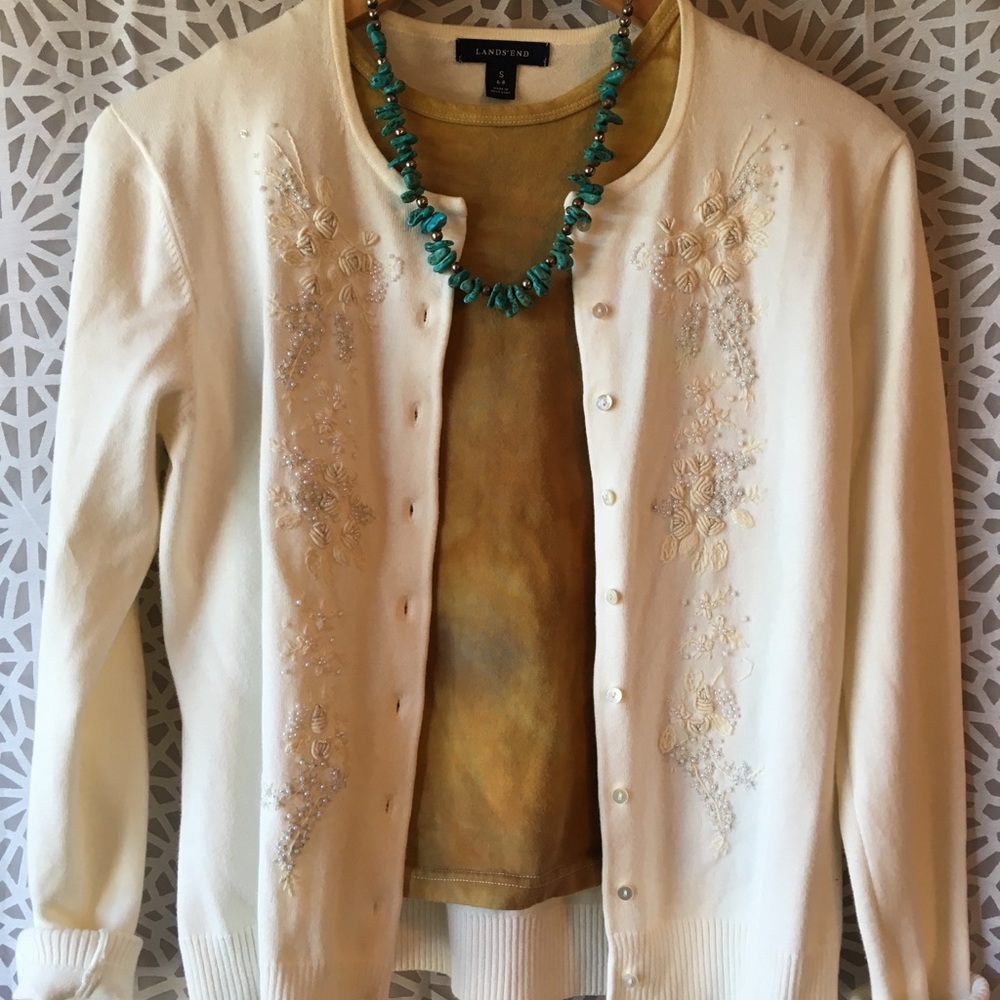 cream embroidered cardigan.