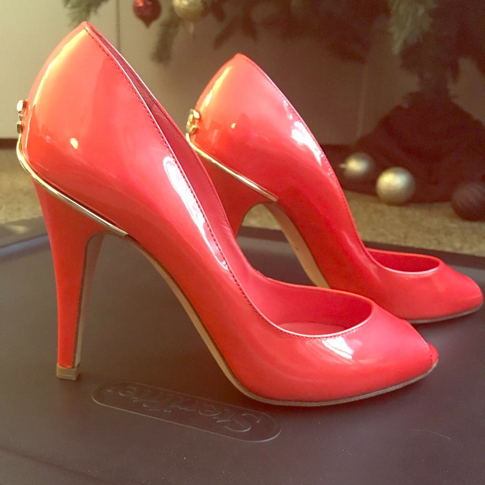 Chanel coral orange peep-toe heels.