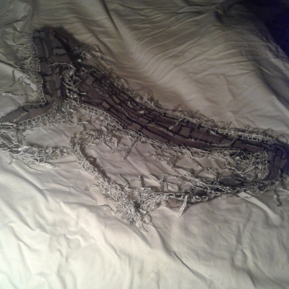 Really cool fringed triangle scarf.