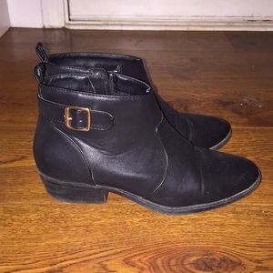 black booties with gold buckle