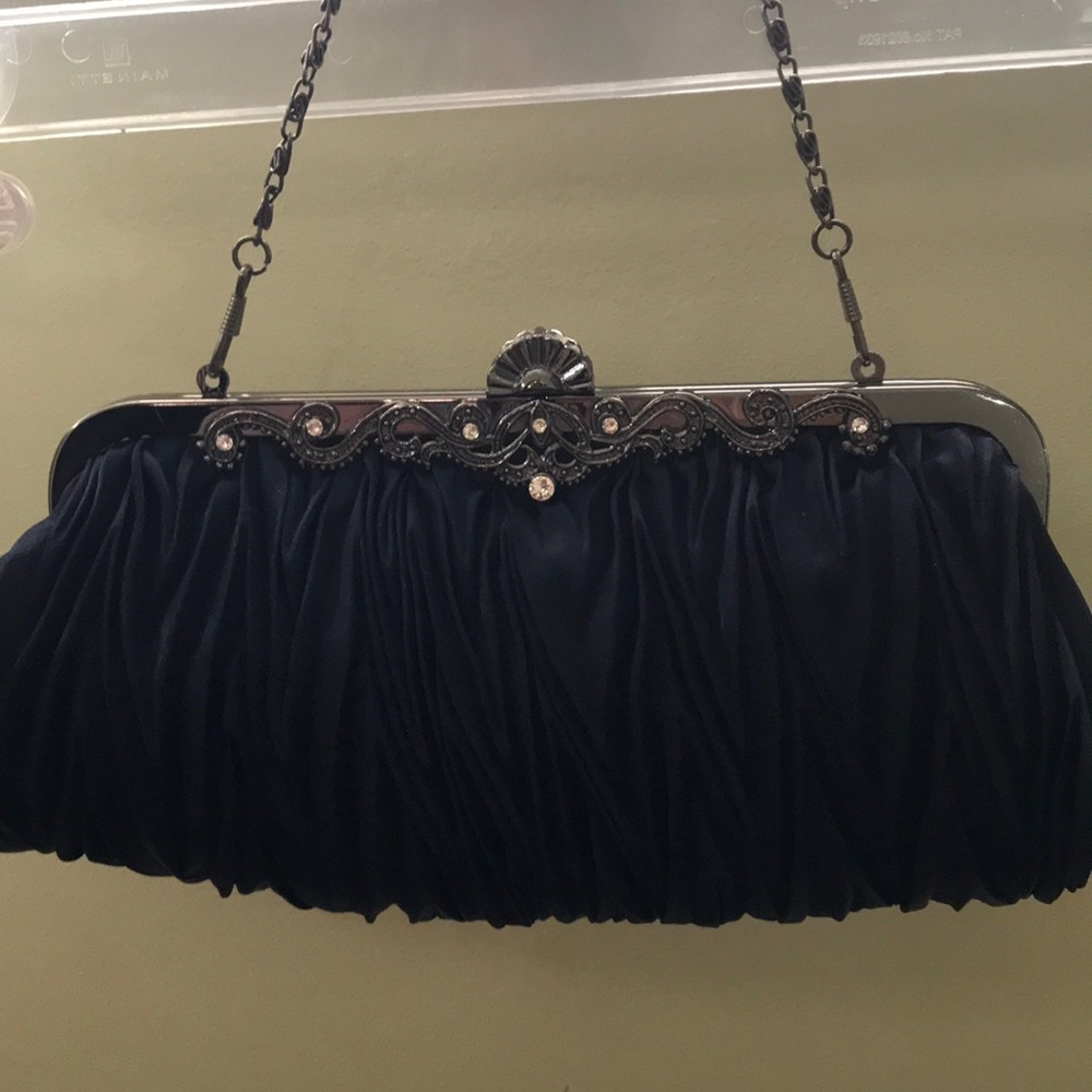 Navy blue clutch bag with silver strap