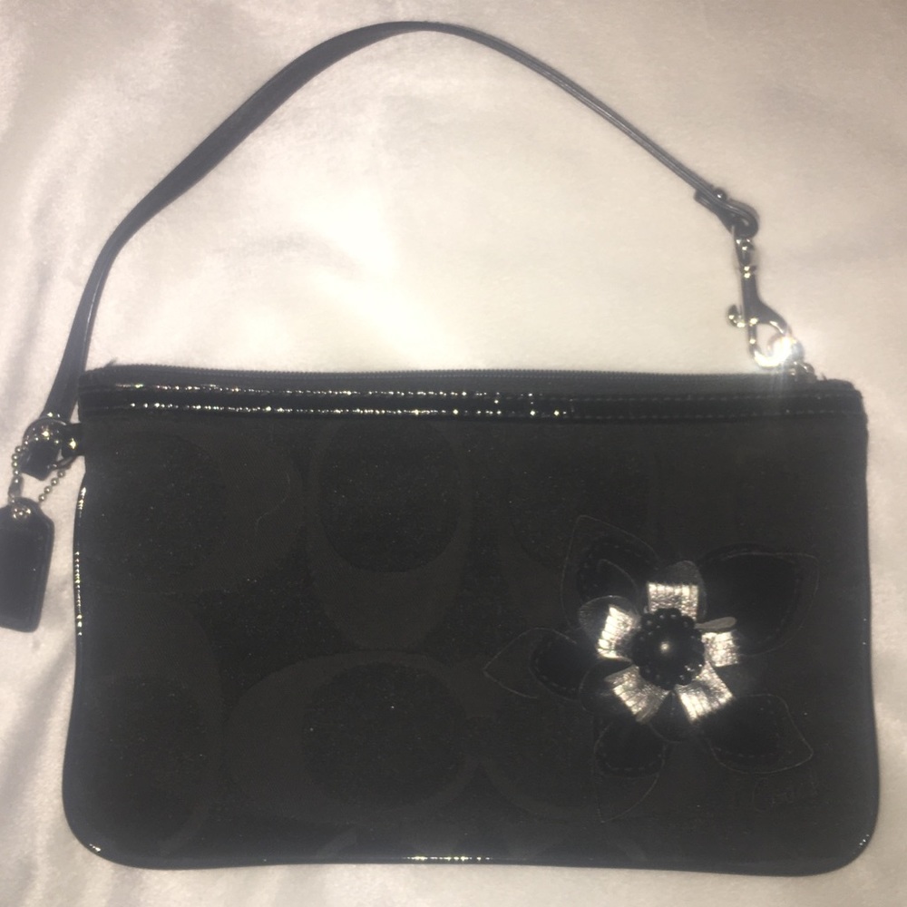 New black COACH wristlet with flower decal!
