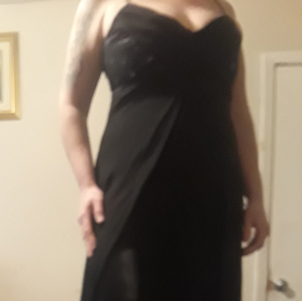 Dress color black with silver sequins.