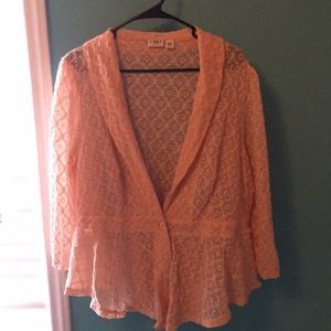 A blush pink one button cover top
