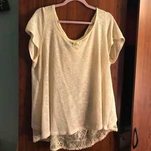 Cream lace sweater with floral back detail.