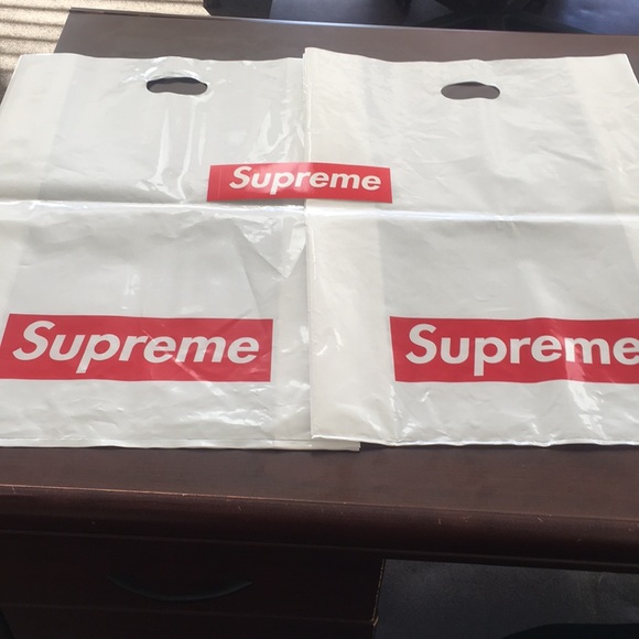 Supreme Other - Supreme bags and a sticker