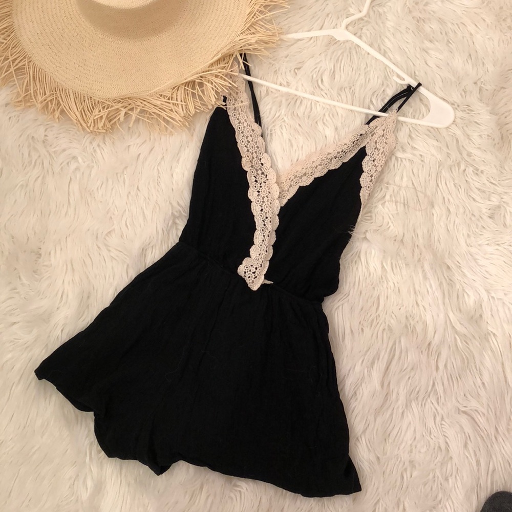Black romper with white lace details