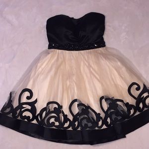 Classy beige and black above-the-knee dress