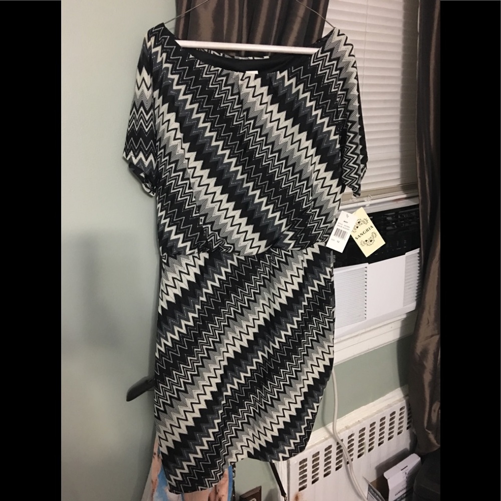 Short sleeve, short stretch black and white dress.