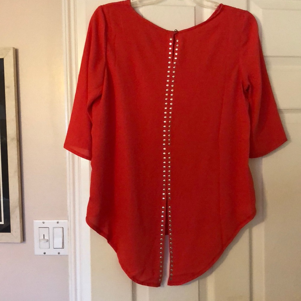 Red blouse with studded back detail