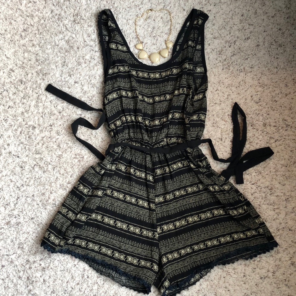 Black and cream romper with navy blue lace trim