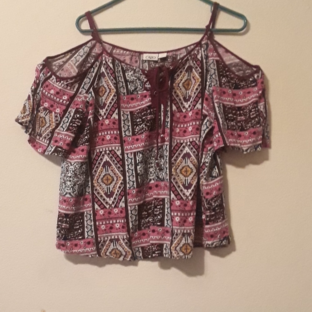 Quilt pattern, floral design, multicolored blouse.