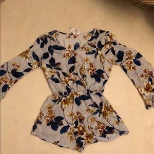 Floral bell sleeve romper. Flirty neckline. Size M