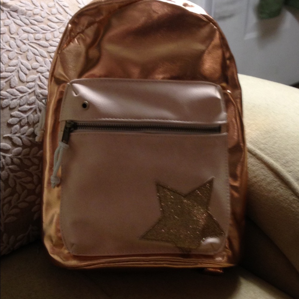 Madden girl rose gold backpack with bling star