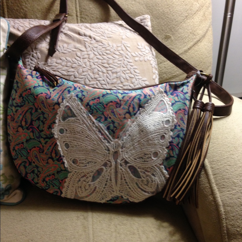 Handbag with lace butterfly on front