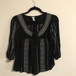 black shirt with aztec design