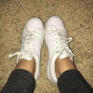 All white Nike sneakers