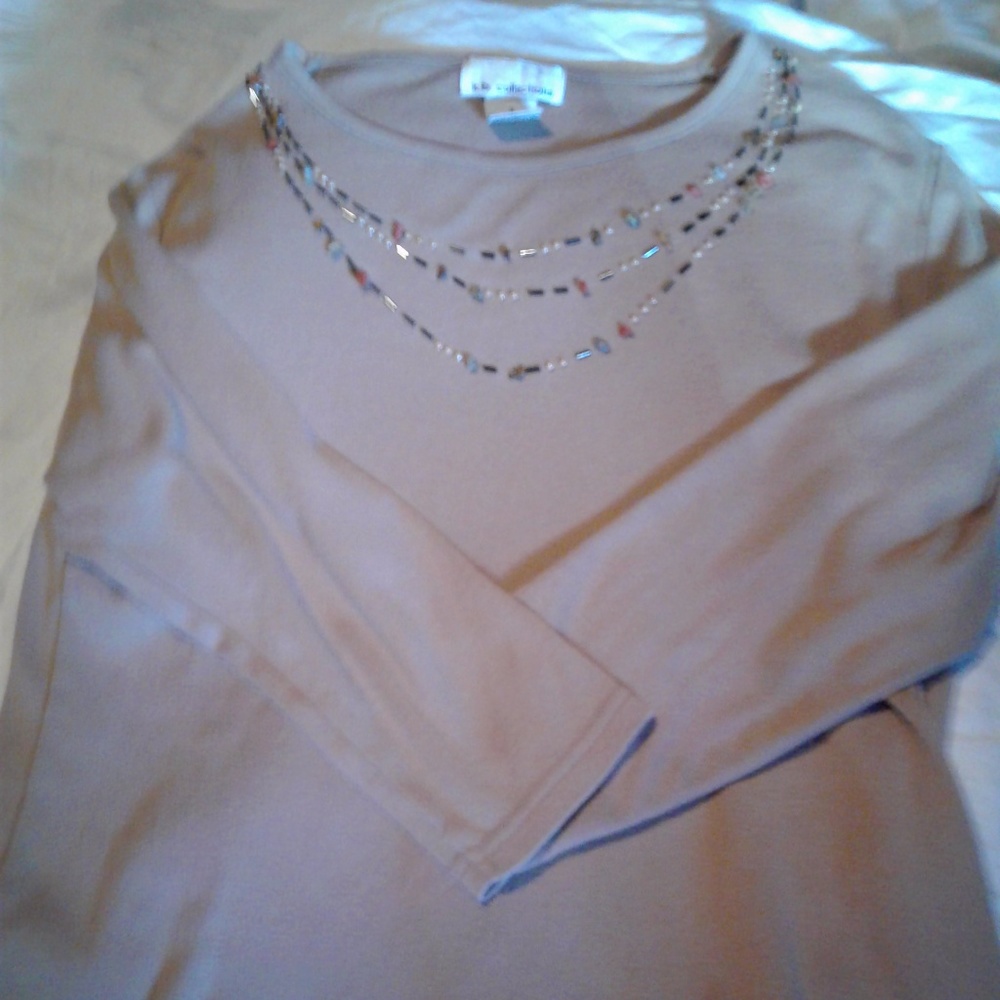 Tan beaded around neck long sleeve shirt.