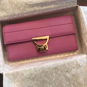 NWT coccinelle genuine leather wallet in Purple!