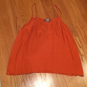 Flowy silk top with gold button embellishments