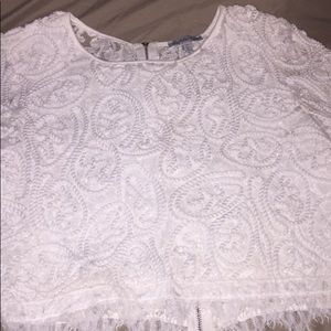 White crop-top blouse.