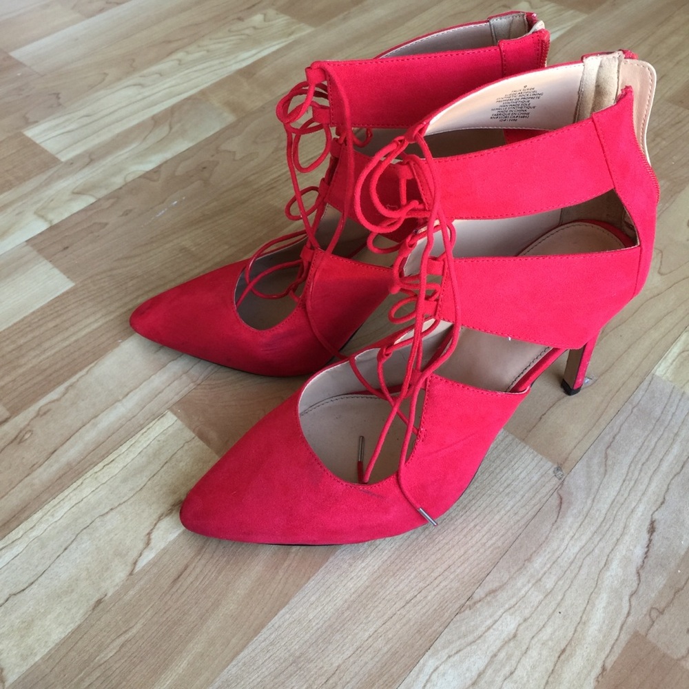 Red lace-up pumps