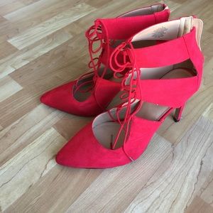 Red lace-up pumps