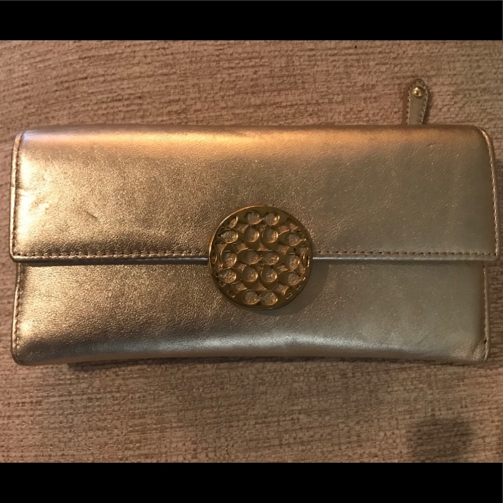 Gold metallic leather coach wallet.
