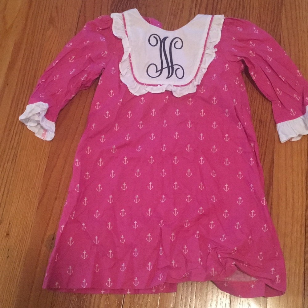 Pink anchored dress with “N” monogram