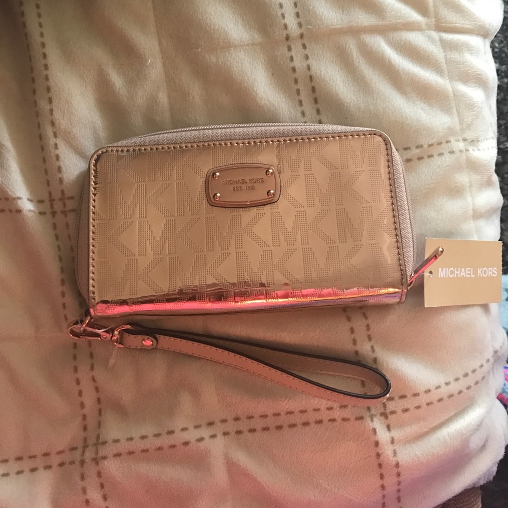 Michael Kors rose gold Wallet/wristlet.
