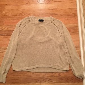 Open back, knit sweater.