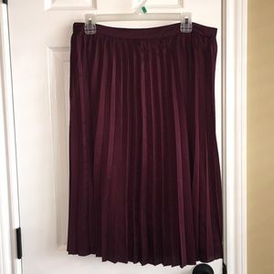 Pleated eggplant skirt.