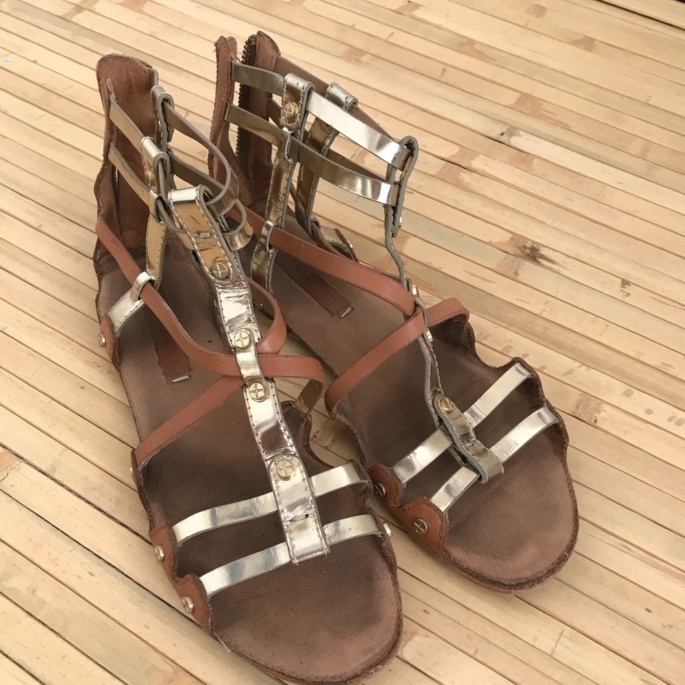 BCBG gladiator sandals in gold and tan leather.