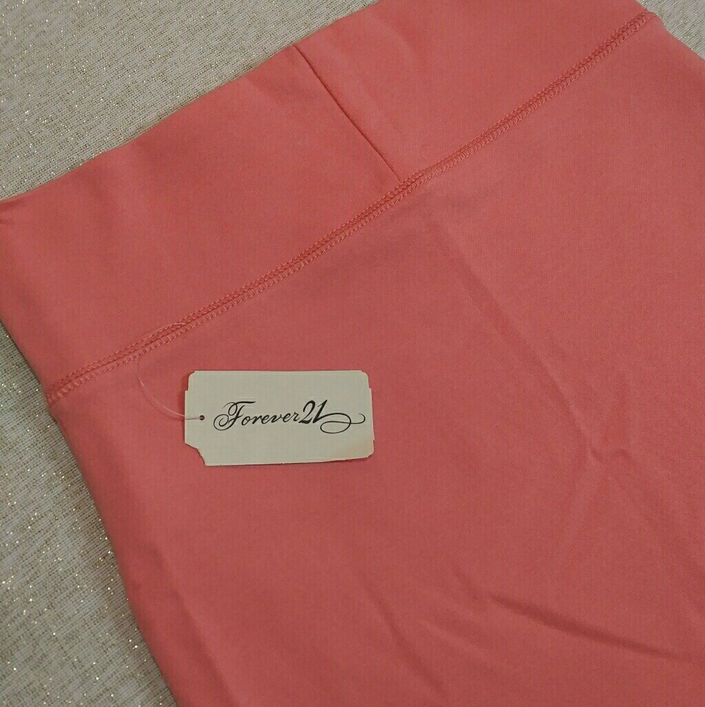 Forever 21 high waisted knee length coral skirt.