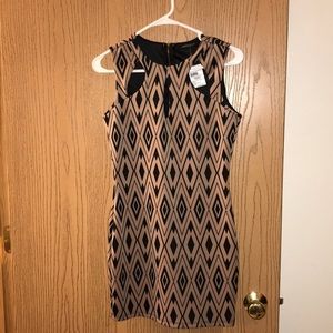 NWT! Patterned dress with cut outs along neck line