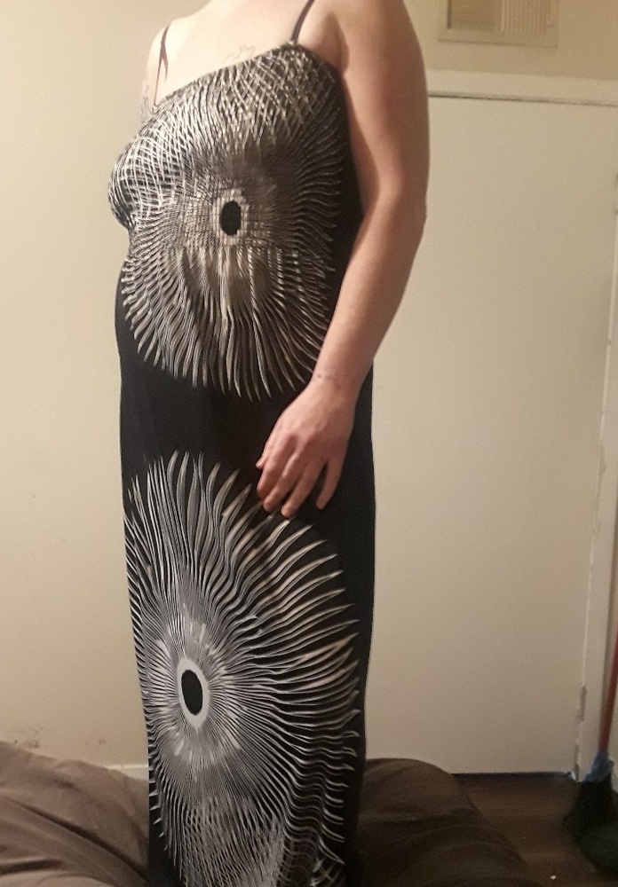 Full length dress with white pattern design.