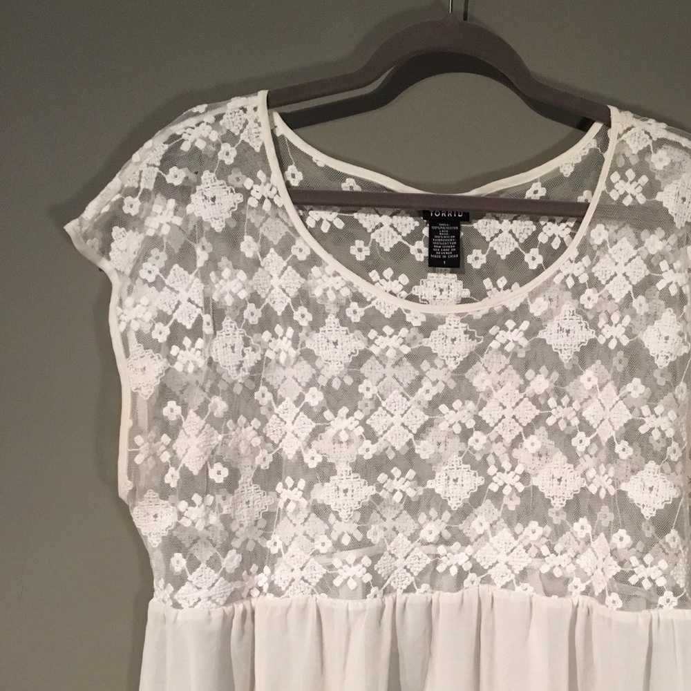 Sheer top with Aztec embroidered detail.