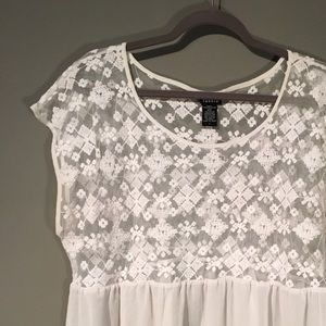 Sheer top with Aztec embroidered detail.