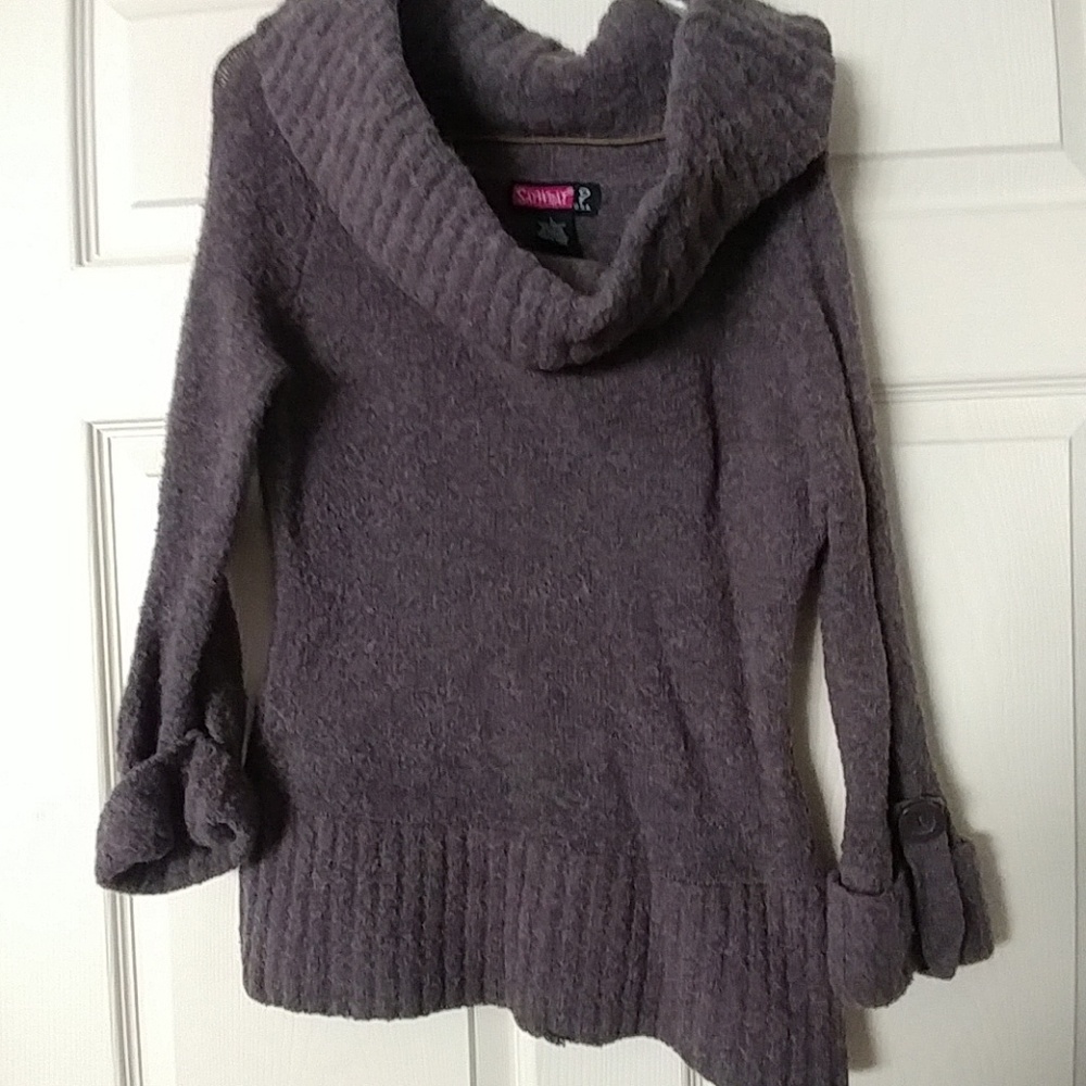 Purple sweater with wide collar.